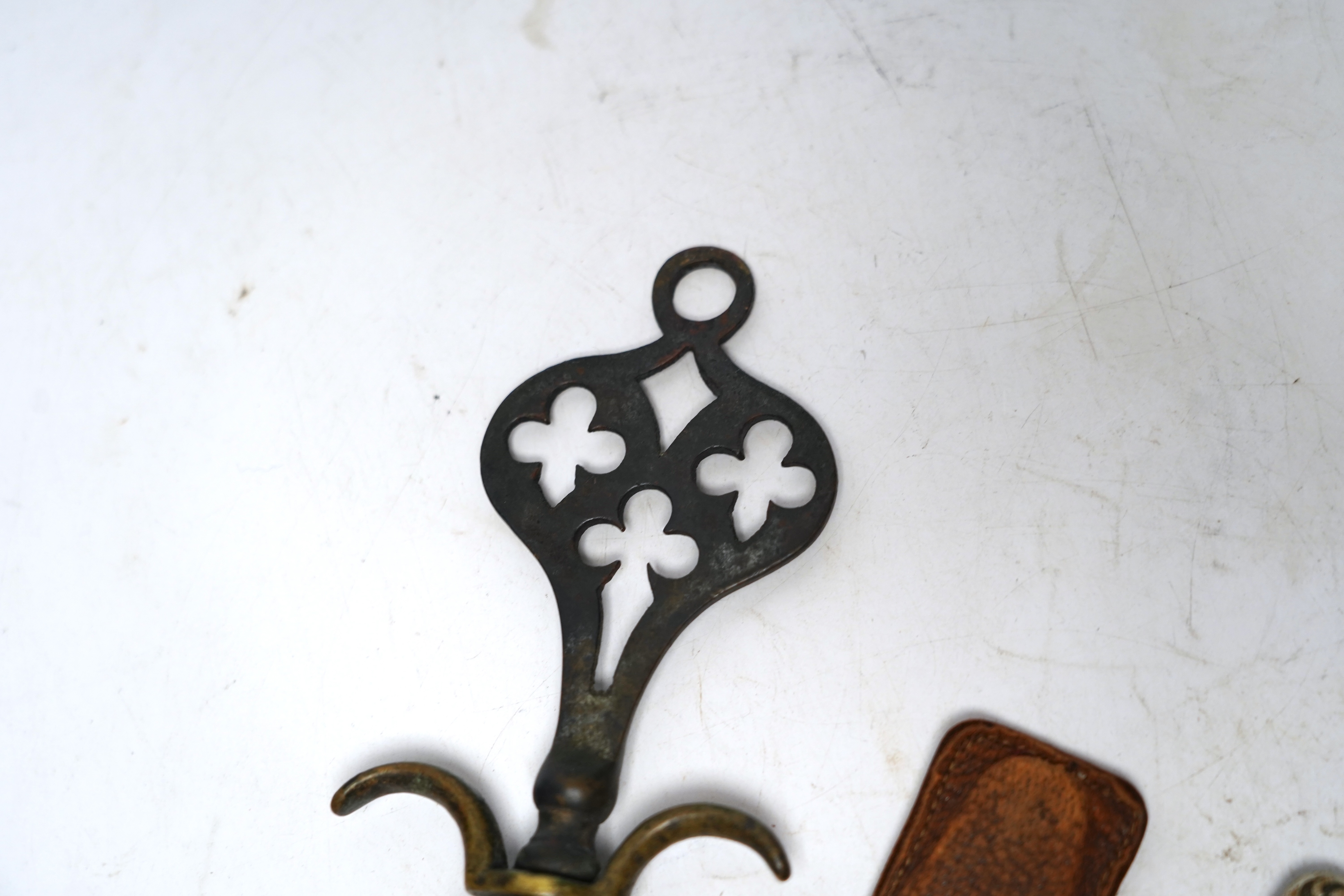 Two corkscrews; one advertising Jean E Sottiris-Le Caire, on reverse, Cognac Bisquit, Bisquit Du Bouche &Cie Cognac together with an ornate brass corkscrew largest 14cm